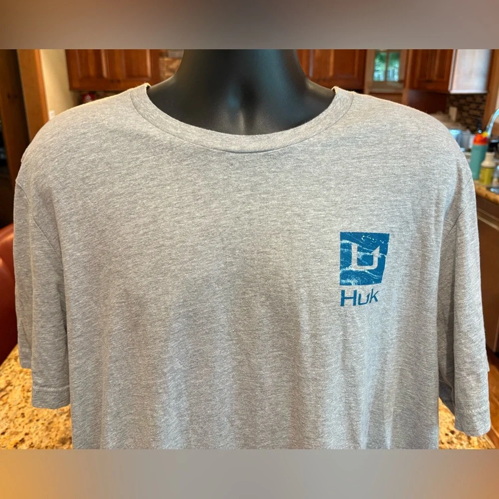 Huk men’s Outer Banks Angler t-shirt. Sharp blue print w/logos front/back/sleeve